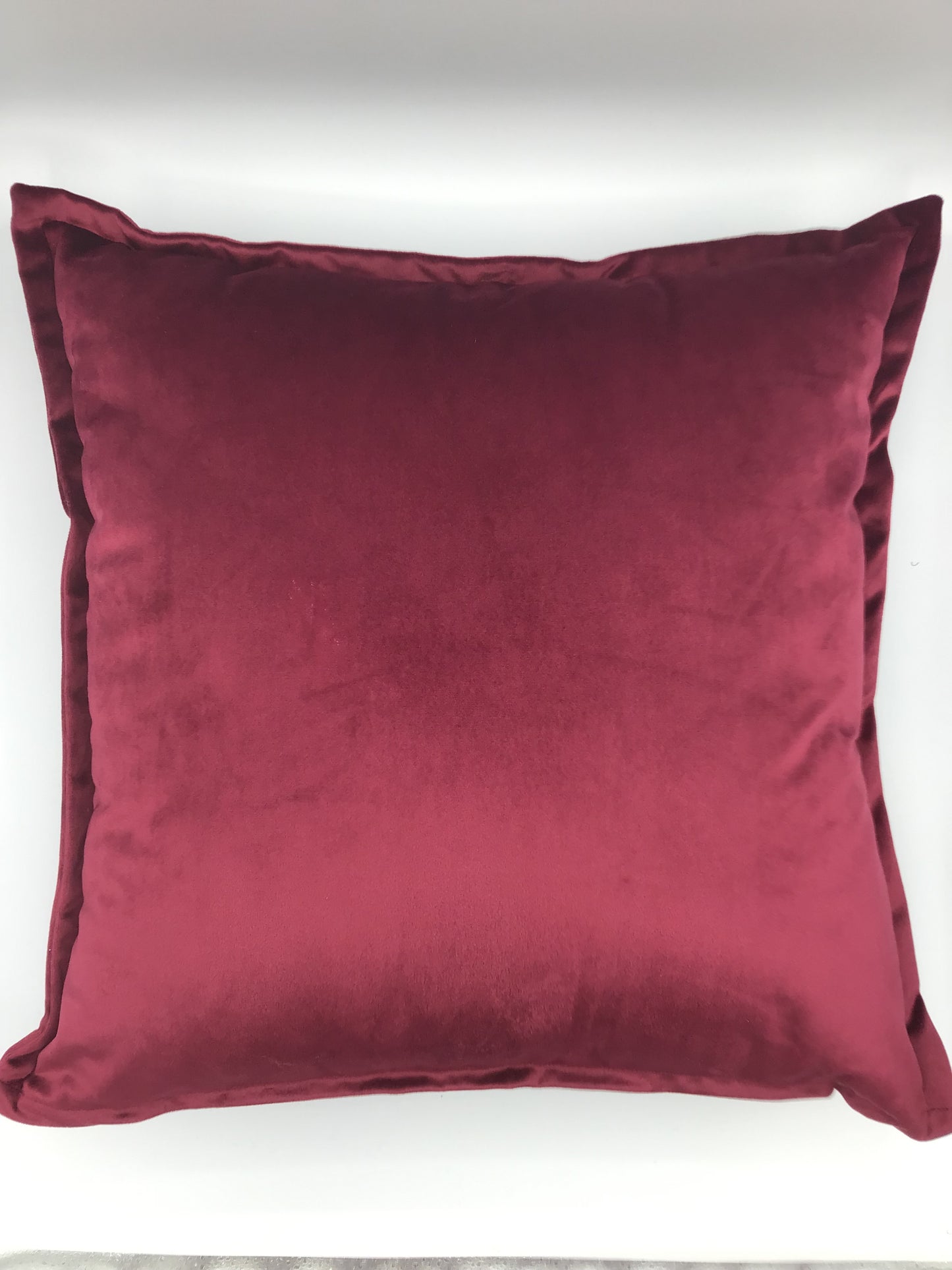 Burgundy velvet cushion