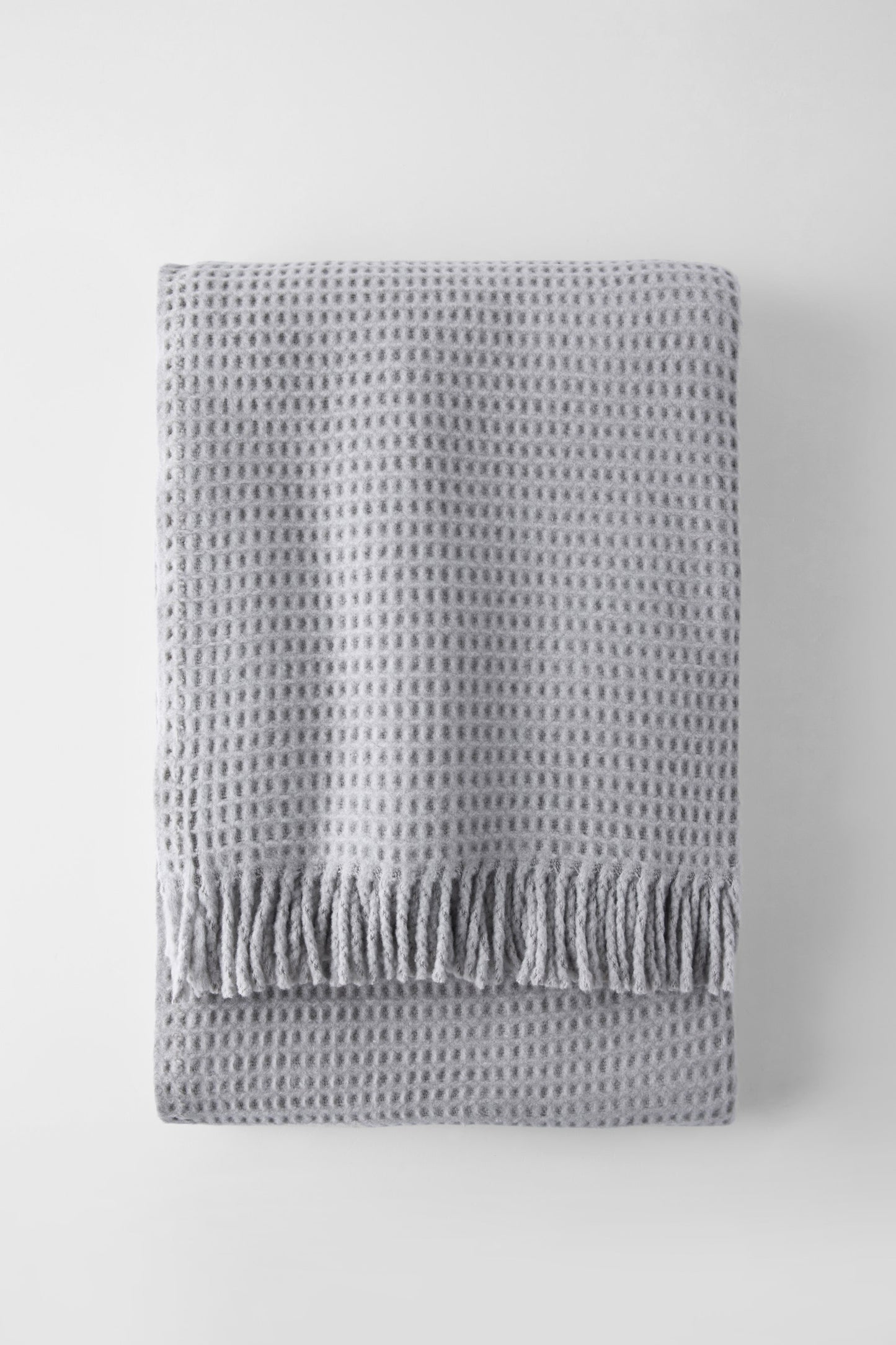 Basic decorative throw in pale gray waffle