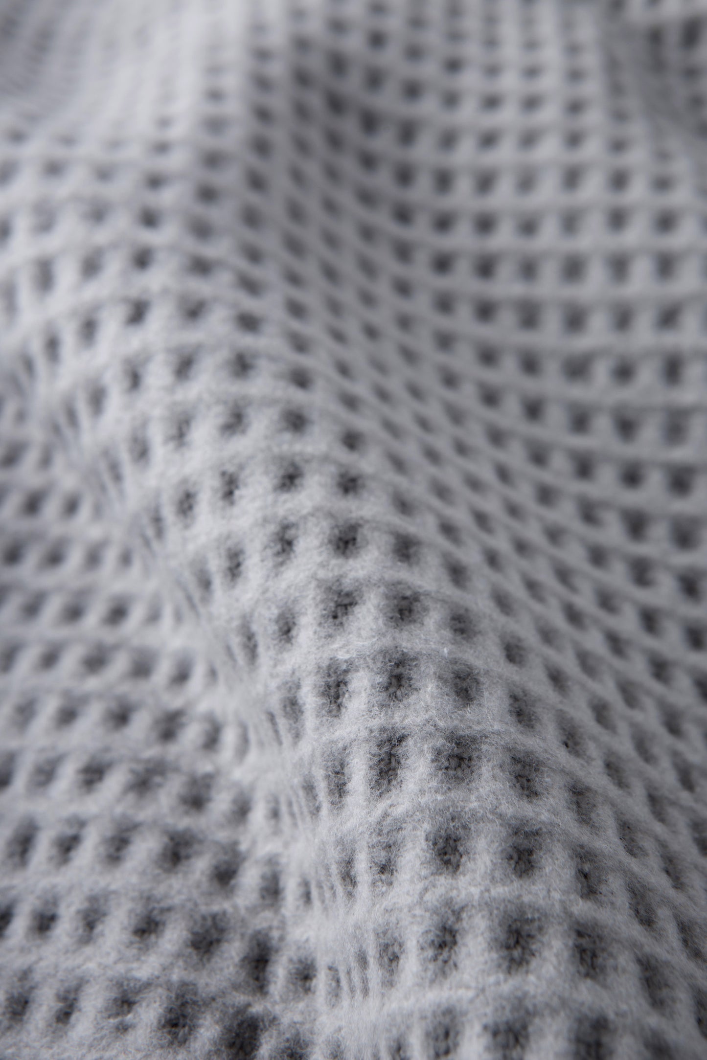Basic decorative throw in pale gray waffle